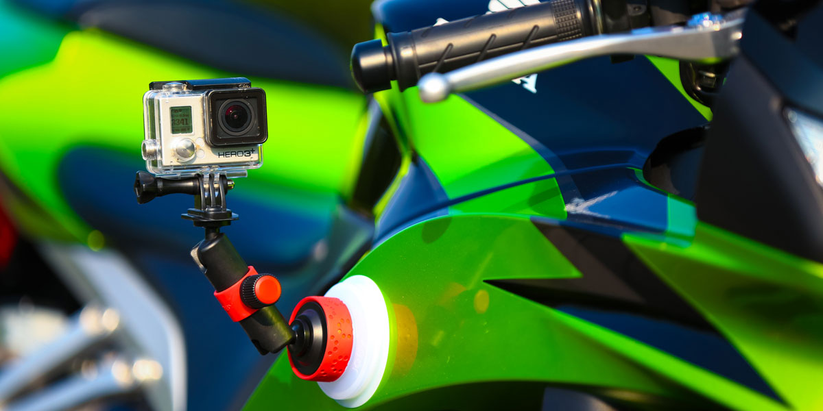 Suction cup with locking arm in action