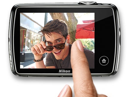photo of woman's finger on the touchscreen of the S01 with a photo of a young man on the LCD
